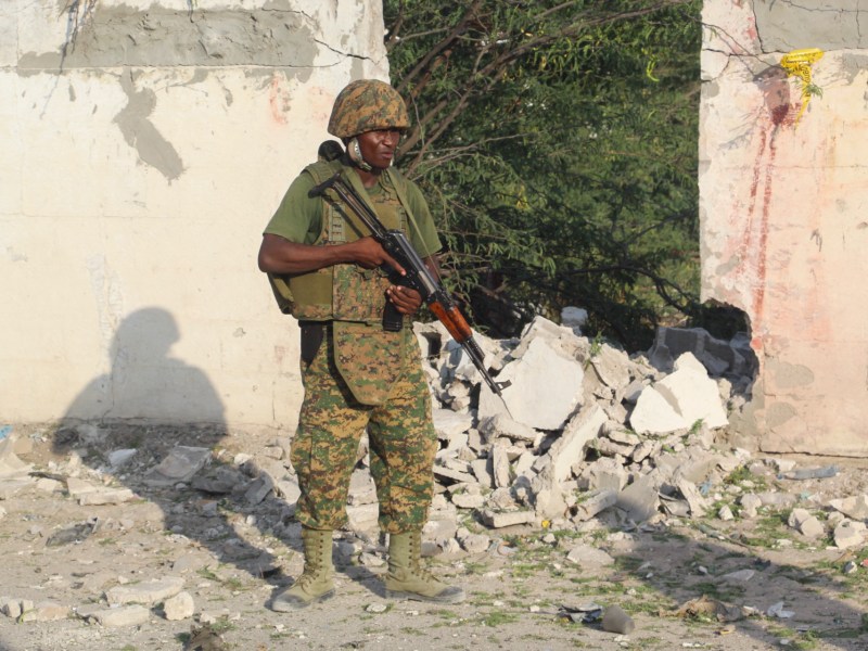 An African Union Mission to Somalia (AMISOM) soldier stands at the scene of a suicide bombing that targeted an AMISOM convoy in Mogadishu, Somalia, on November 11, 2021. Photo by -/AFP via Getty Images