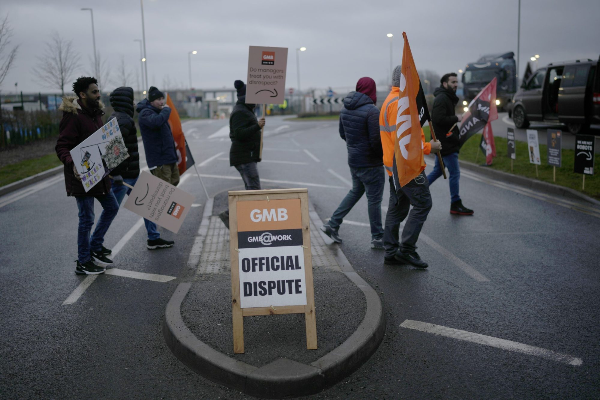 people walking with signs