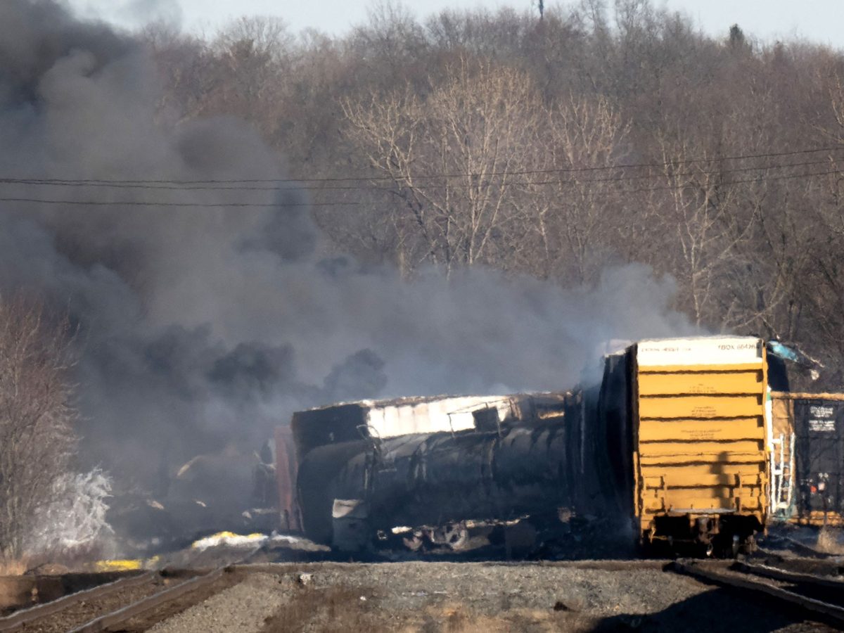 Smoke rises from a derailed cargo train in East Palestine, Ohio, on February 4, 2023.