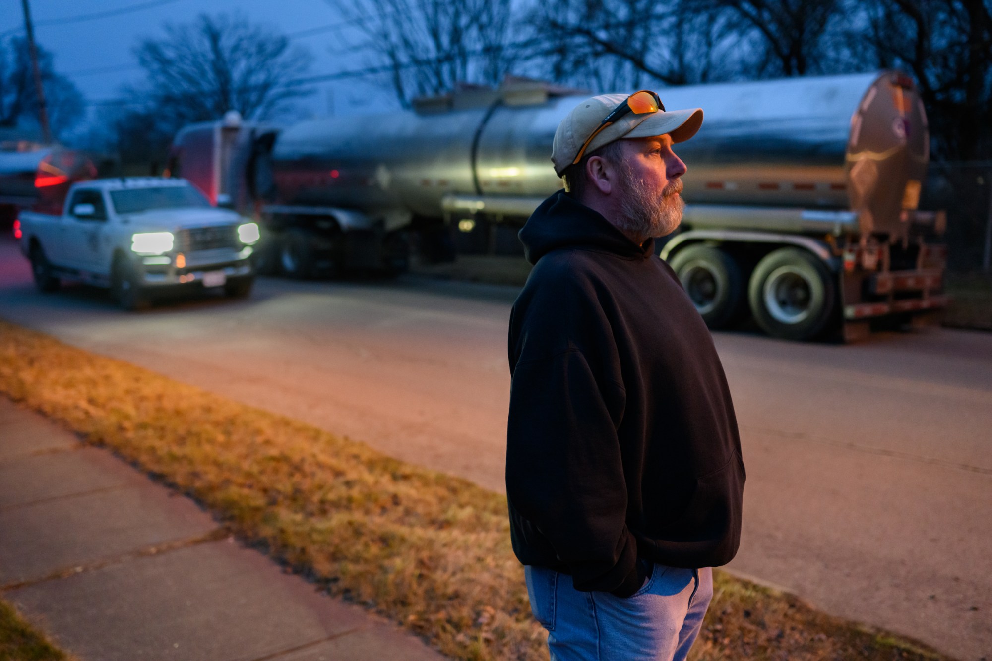 Ben Terwilliger stands outside his home in East Palestine, OH. Ben lives a block from the site of the Norfolk Southern train derailment and chemical spill. Photo by Rebecca Kiger for The Washington Post via Getty Images