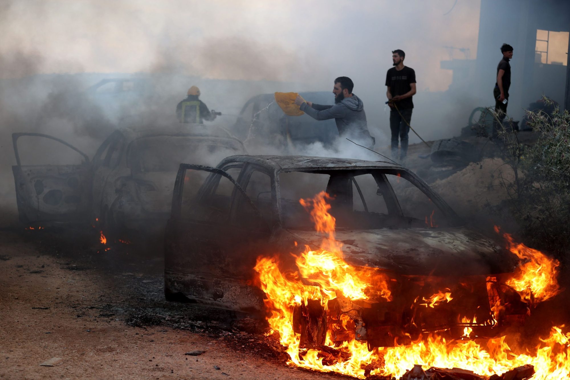 A view of damaged houses and burning vehicles after a raid by Jewish settlers on the Mughir town near Ramallah, West Bank on April 12, 2024. Photo by Issam Rimawi/Anadolu via Getty Images