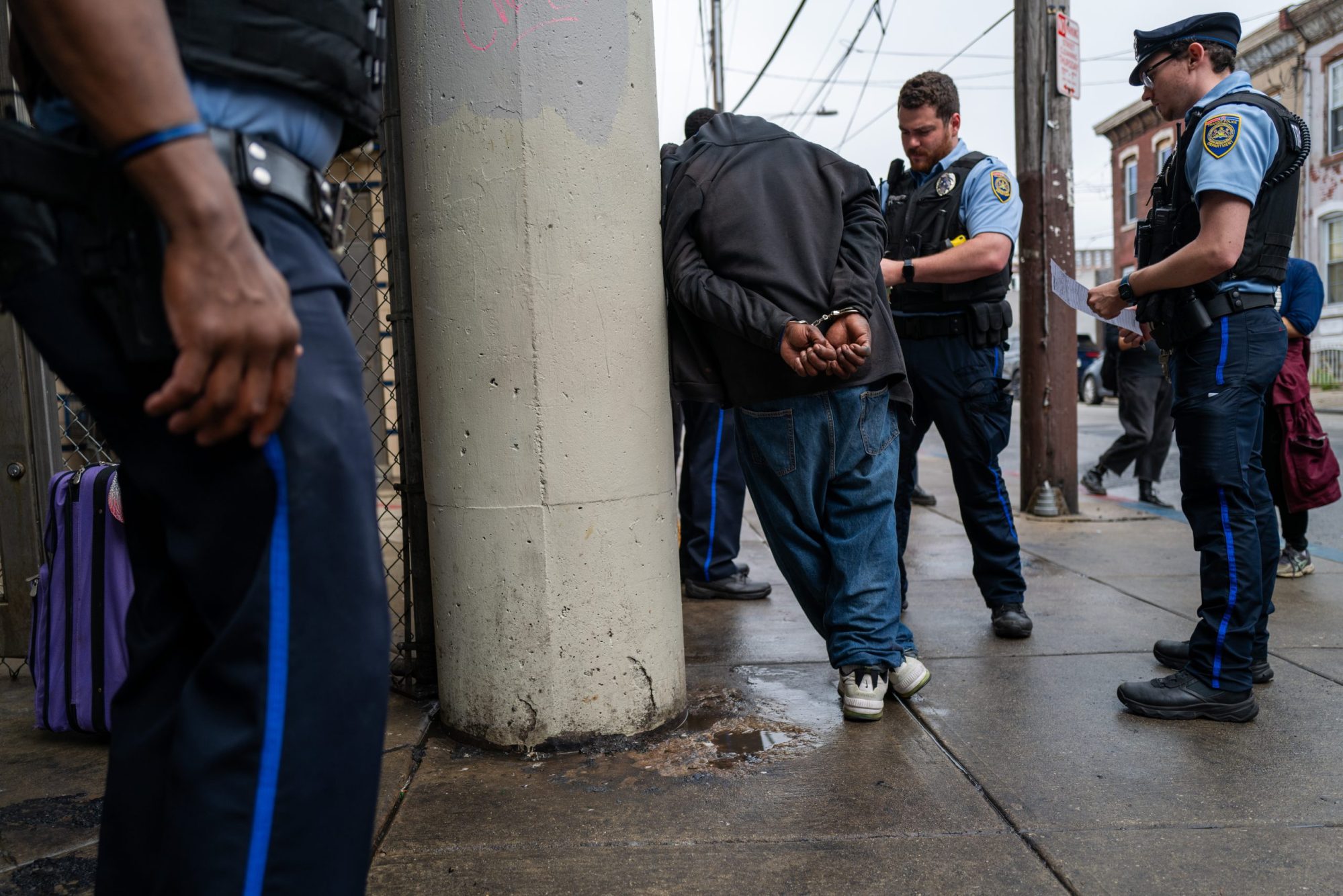 Police arrest a man as the city of Philadelphia begins a long anticipated clearing of the drug encampment in the Kensington section of Philadelphia on May 08, 2024, in Philadelphia, Pennsylvania.