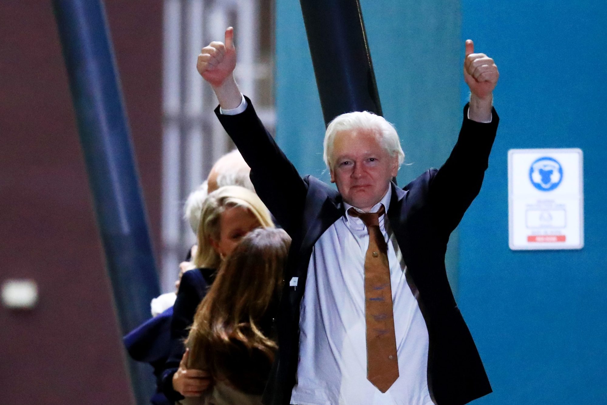 WikiLeaks founder Julian Assange gestures as he arrives at Canberra Airport on June 26, 2024 in Canberra, Australia. Photo by Roni Bintang/Getty Images