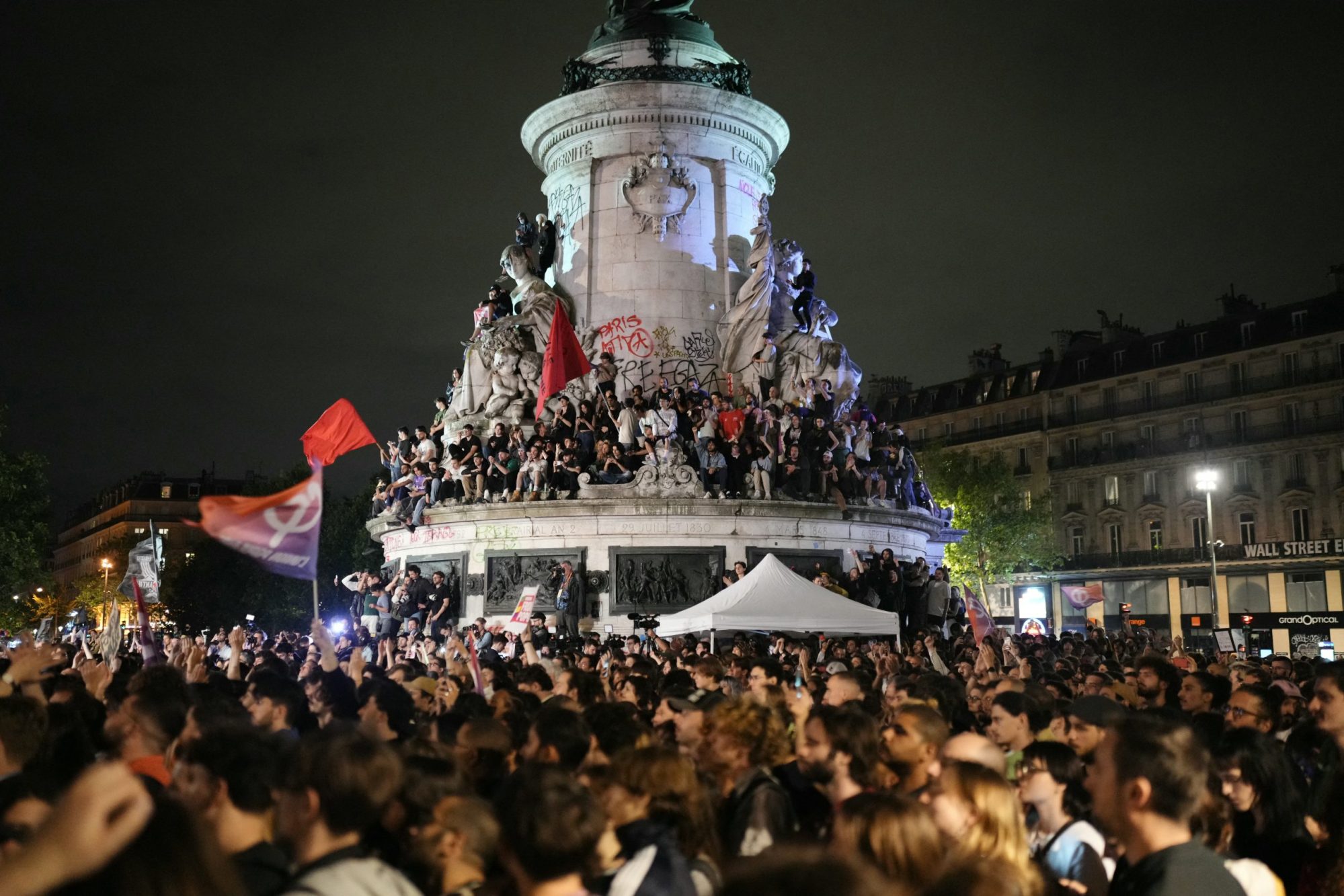 Demonstrators take part in a rally against far-right after the announcement of the results of the first round of parliamentary elections, at Place de la Republique in Paris on June 30, 2024. Photo by DIMITAR DILKOFF/AFP via Getty Images