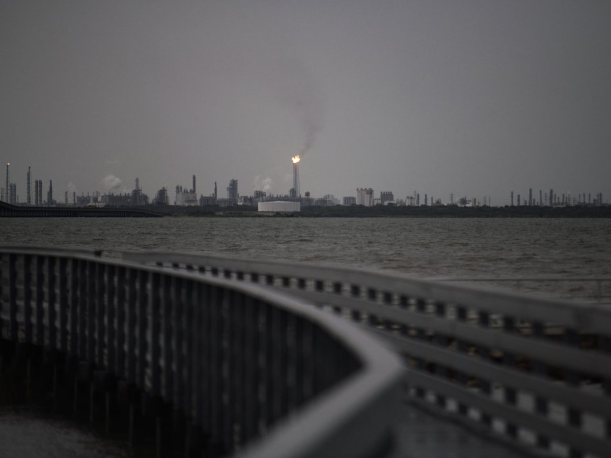 A flaring stack in Port Comfort can be seen from a nature boardwalk in Port Lavaca, Texas, on July 7, 2024. Photo by MARK FELIX/AFP via Getty Images