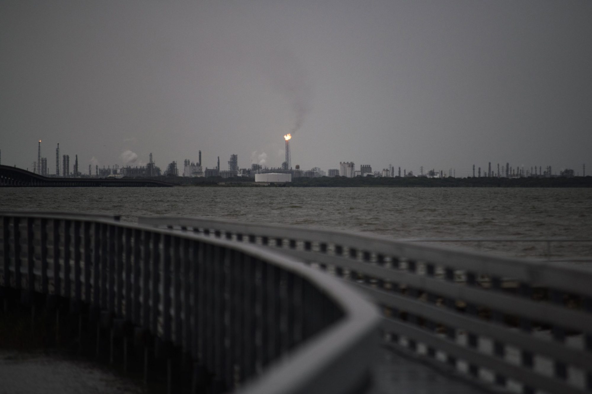 A flaring stack in Port Comfort can be seen from a nature boardwalk in Port Lavaca, Texas, on July 7, 2024. Photo by MARK FELIX/AFP via Getty Images