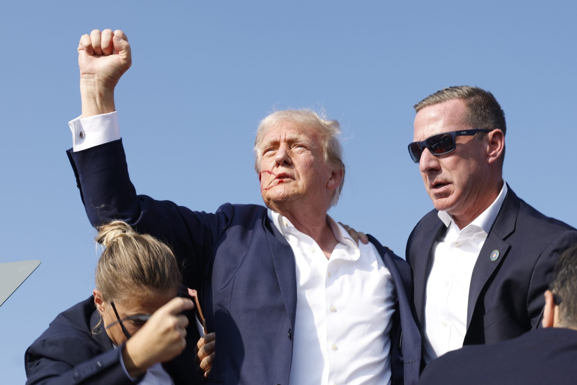 Republican presidential candidate former President Donald Trump is rushed offstage during a rally on July 13, 2024 in Butler, Pennsylvania. Photo by Anna Moneymaker/Getty Images