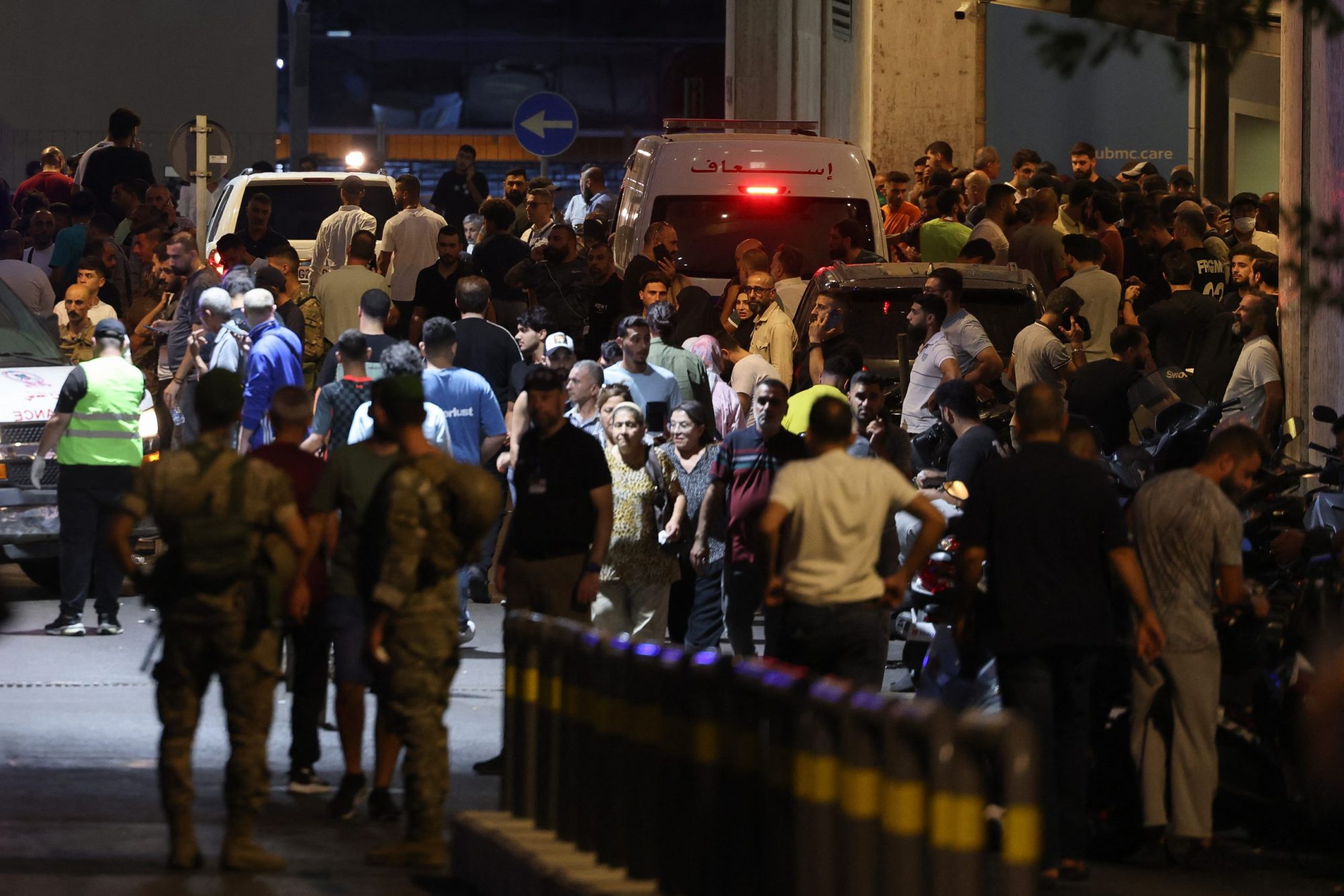 People gather at the entrance of the American University of Beirut Medical Center, on September 17, 2024, after explosions hit locations in several Hezbollah strongholds around Lebanon. Photo by ANWAR AMRO/AFP via Getty Images