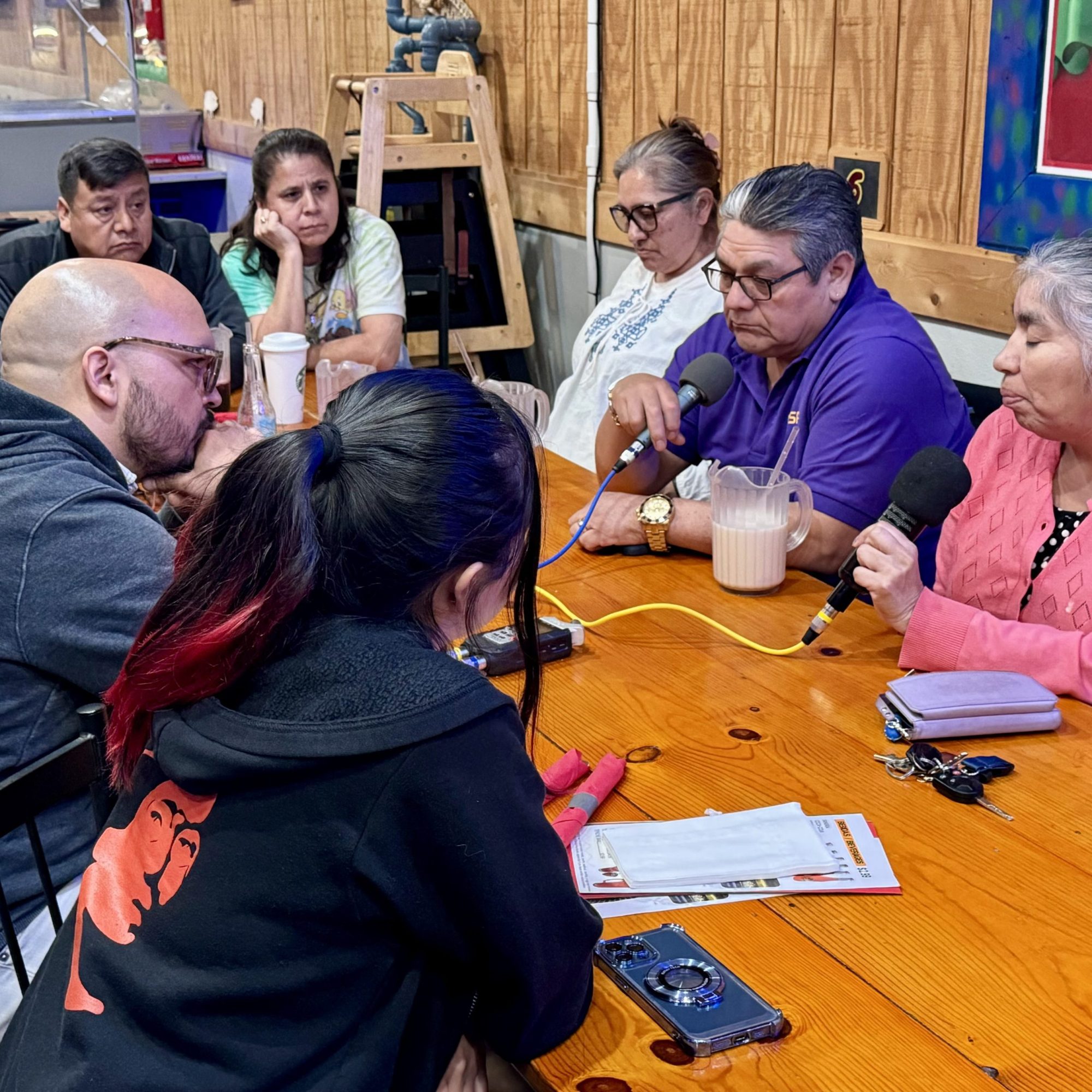 TRNN Editor-in-Chief Maximillian Alvarez (far left) records an in-person podcast with members of the Baltimore Latino/Latine community, including: Victor (top left) and Claudia (top center), co-owners of El Taquito Mexicano restaurant; Lucia Islas (top right) of Comité Latino de Baltimore; Carlos Crespo (right center) of Centro de Apoyo Para la Superación del Inmigrante; Susana Barrios (far right) of Latino Racial Justice Circle; and Norma Martinez (bottom left), a high-school student in Baltimore from Honduras. Photo taken on March 29, 2024 by Ricardo Ortíz of Centro de Apoyo Para la Superación del Inmigrante.