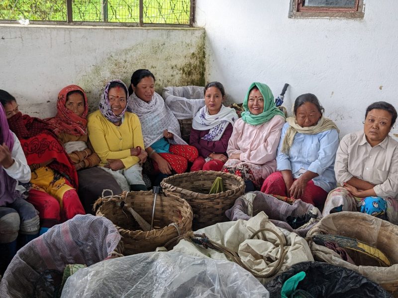 A group of women tea workers sit together around their tea baskets during a work stoppage at the Happy Valley Tea Estate in Darjeeling, India, on October 12, 2022.