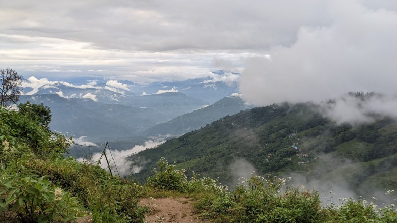 Landscape photo of green, rolling hills on and around the Happy Valley Tea Estate in Darjeeling, India, on October 12, 2022.