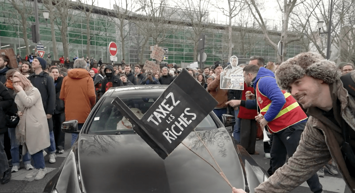 Man holding sign in a protest