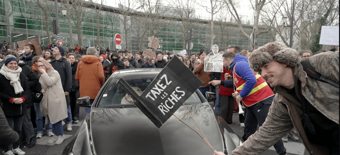 Man holding sign in a protest