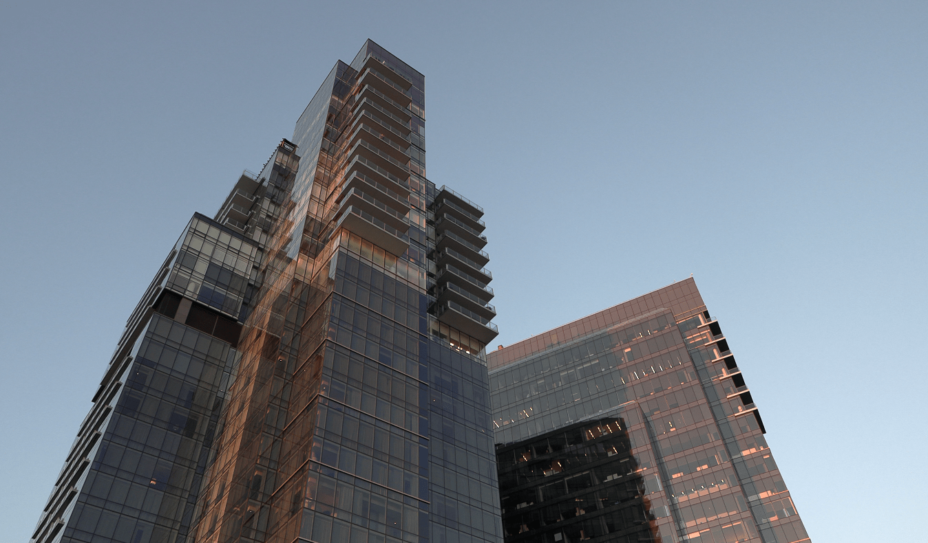 Photo from below of a skyscraper.