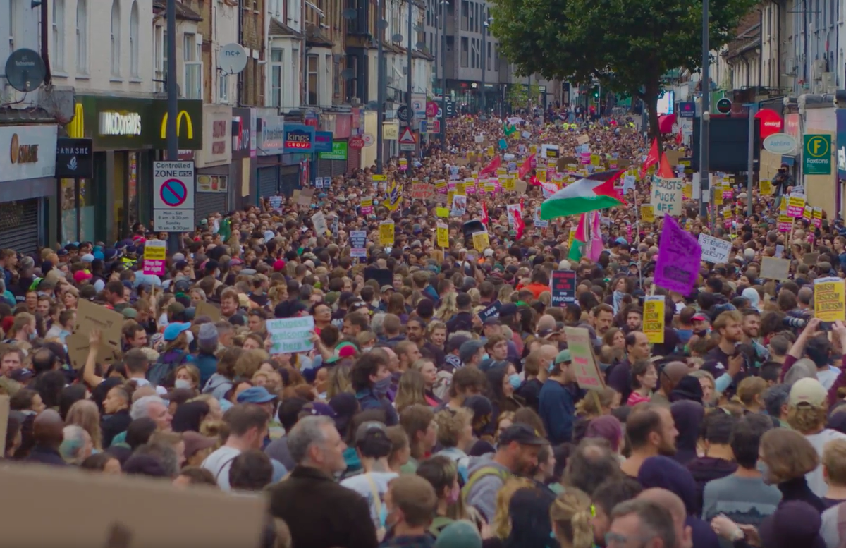 A massive crowd of anti-racist protesters gather on a London street to oppose the nationwide upsurge in violence by fascist gangs.