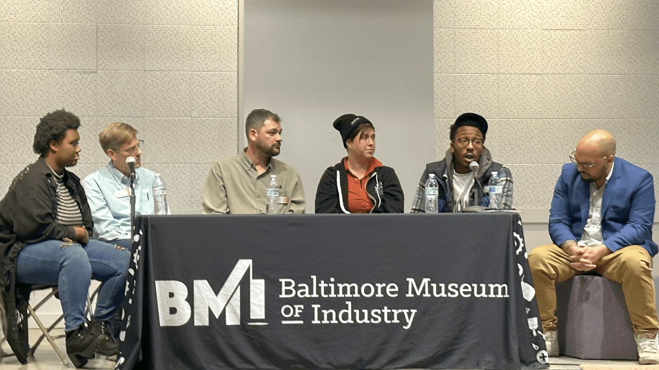 Workers from co-op businesses across the city of Baltimore speak on a panel at the Baltimore Museum of Industry. Photo by Kayla Rivara