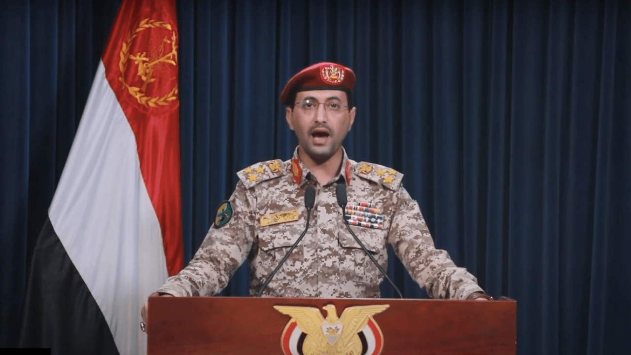 Ansarallah Spokesman Yahya Saree delivers an address reporting on a recent Yemeni military operation in the Red Sea. Screenshot courtesy of Al Masirah TV