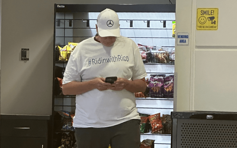 A manager wearing a T-shirt supporting the new CEO waited in the plant cafeteria for results from the vote count. The company's winning move was to fire its U.S. CEO and replace him with a vice president who promised to care about the “team members.” Photo: Luis Feliz Leon